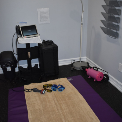 A exercise room with a purple mat